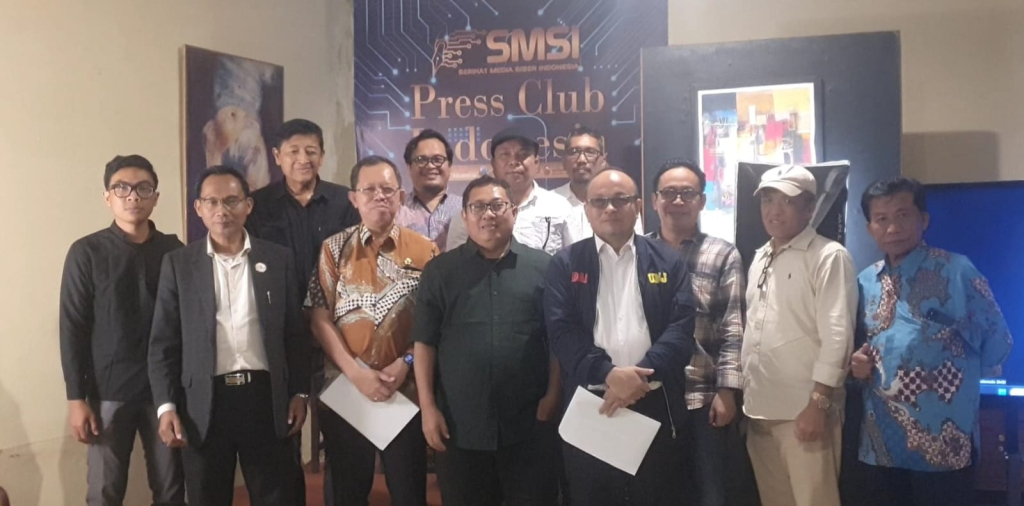SIMPOSIUM - Serikat Media Siber Indonesia (SMSI) menggelar Simposium Nasional bertema Pilkada dalam Bingkai Demokrasi Pancasila bertempat di Press Club Indonesia, Kantor SMSI Pusat, Jalan Veteran II No 7C, Gambir, Jakarta Pusat, Rabu (14/01/2026).