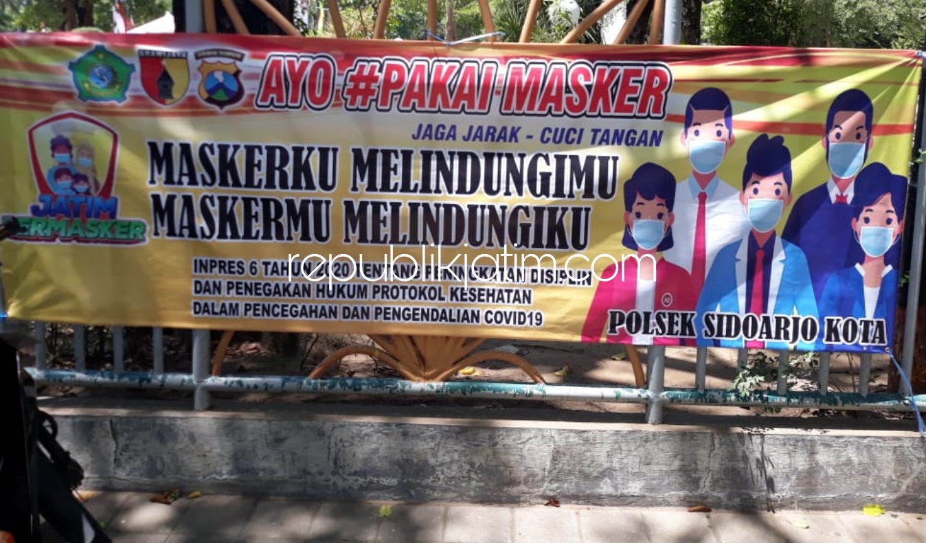 HIMBAUAN - Salah satu banner himbauan memakai masker yang dipasang Polresta Sidoarjo di sejumlah lokasi, Kamis (27/08/2020). 