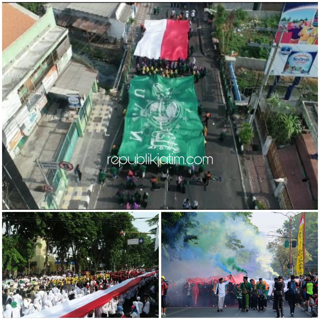 RAKSASA - Bendera merah putih sepanjang 1.000 meter dikirab dalam peringatan Hari Santri Nasional (HSN) V Tahun 2019 di Sidoarjo, Minggu (20/10/2019).