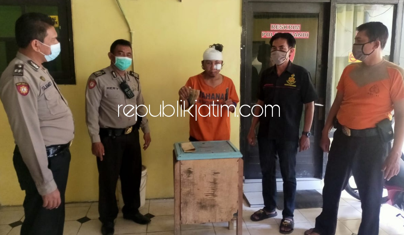 BABAK BELUR - Tersangka pencurian kotak amal, Edi Hermanto (36) warga Dusun Bulurejo, Desa Warujayeng, Kecamatan Tanjunganom, Nganjuk babak belur saat diamankan di Polsek Candi beserta barang bukti curiannya, Jumat (30/10/2020). 