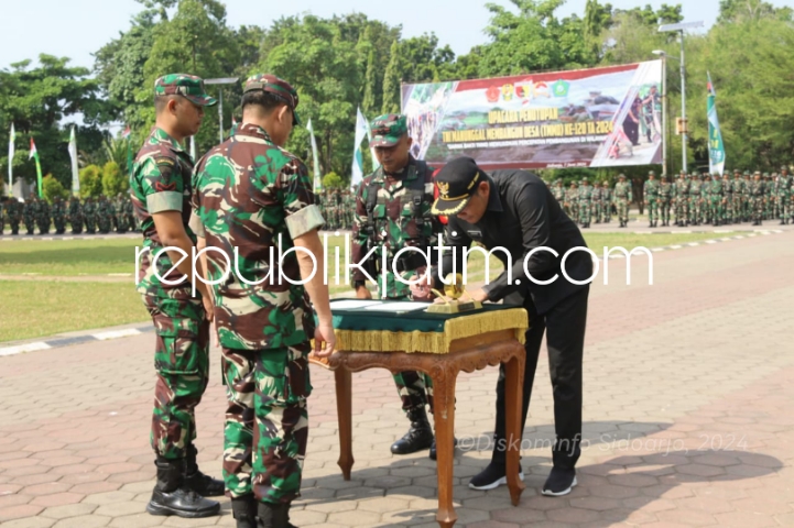 PENUTUPAN - Kegiatan Tentara Manunggal Membangun Desa (TMMD) ke 120 Tahun Anggaran 2024 yang dilaksanakan Kodim 0816 Sidoarjo di Desa Penambangan, Kecamatan Balongbendo secara resmi ditutup, Jumat (07/06/2024).
